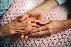 Elderly Hand Being Held